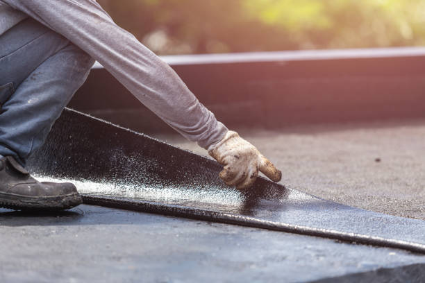 Professional Basement Waterproofing technician working in Little River, KS